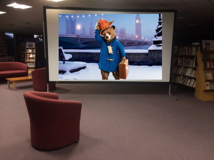 It's big !!! Our screen measures about 2.5 metres by 3.6 metres. This was the very first time it was set up in the Library (the image of Paddington is Photoshopped onto it !)