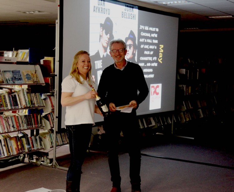 Emma Neppl presents Paul Cartwright with his prize.